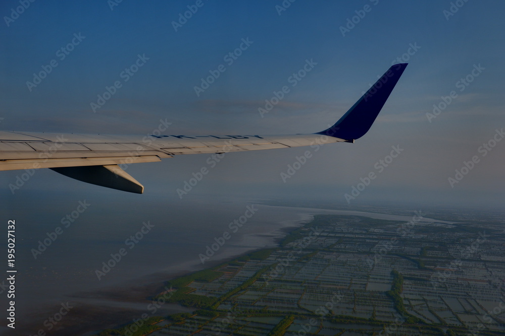 Fototapeta premium Blue Sky and Terrain from Airplane