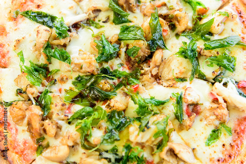 Seafood basil italian pizza with top view on wood table and close up view. Seafood basil italian pizza with top view on wood table and close up view.