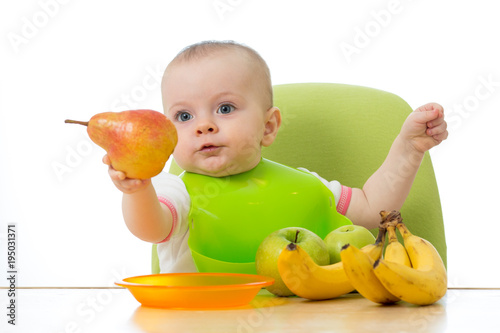Baby having a table full of...