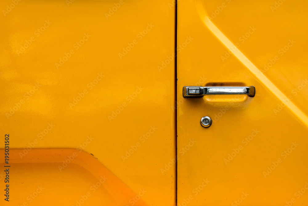 car door handle at yellow truck