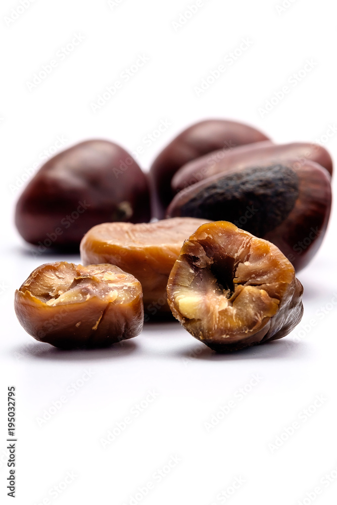 Fototapeta premium Roasted chestnuts on a white background.