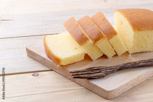 Butter cake on wooden background