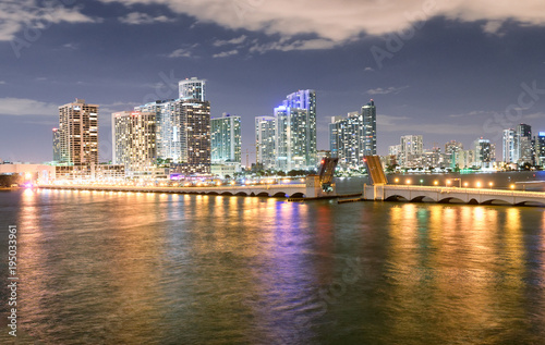 Miami night skyline from MacArthur Causeway. Buildings reflections © jovannig