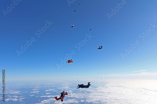 SKydivers in the sky.