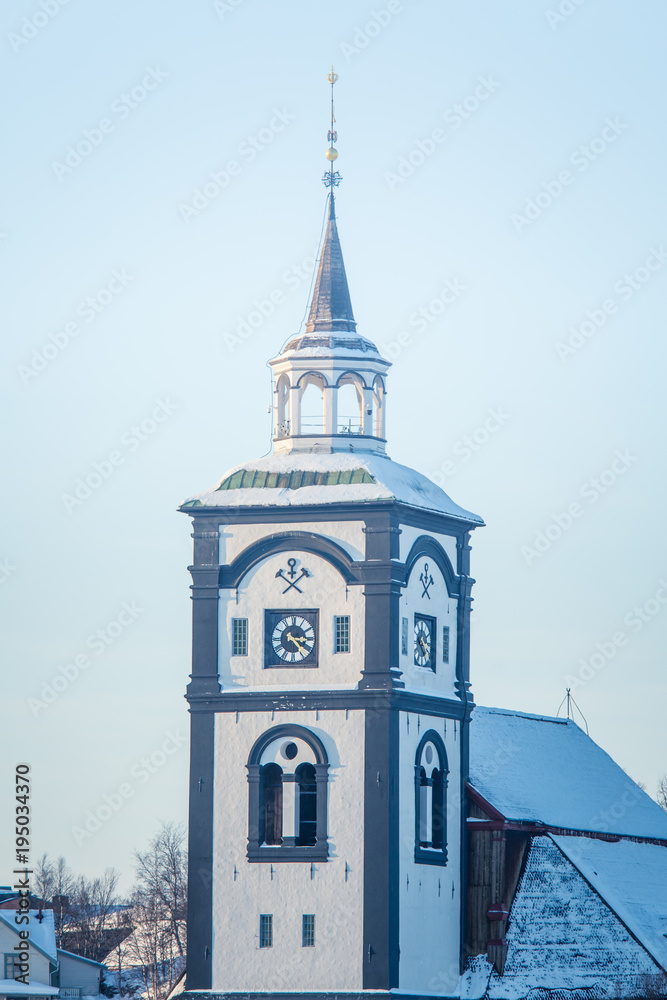 A beautiful tower of Roros church in central Norway. World heritage site. Winter town landscape.