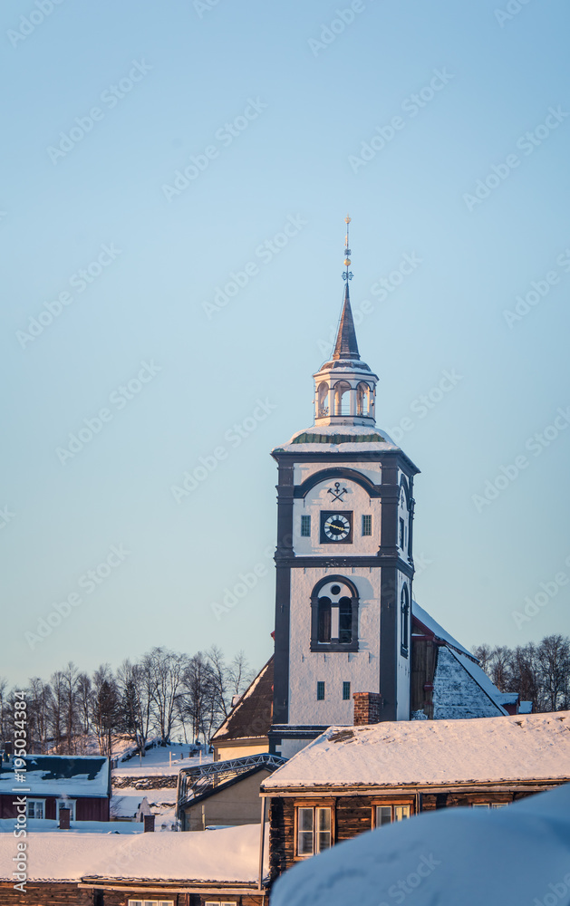 A beautiful tower of Roros church in central Norway. World heritage site. Winter town landscape.
