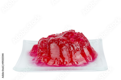 Melted red jelly on square dish isolated clippingpath white background.