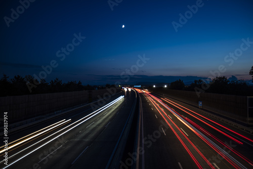 light trace from the cars on night highway 