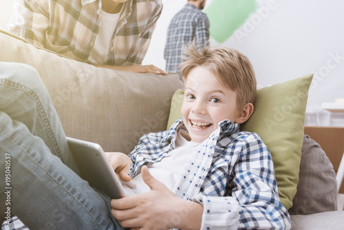 Boy playing with a tablet