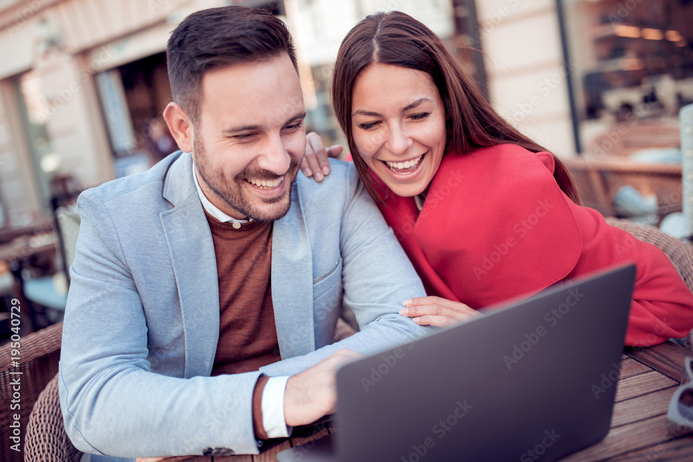 Positive young couple using tablet. Positive young couple using tablet.