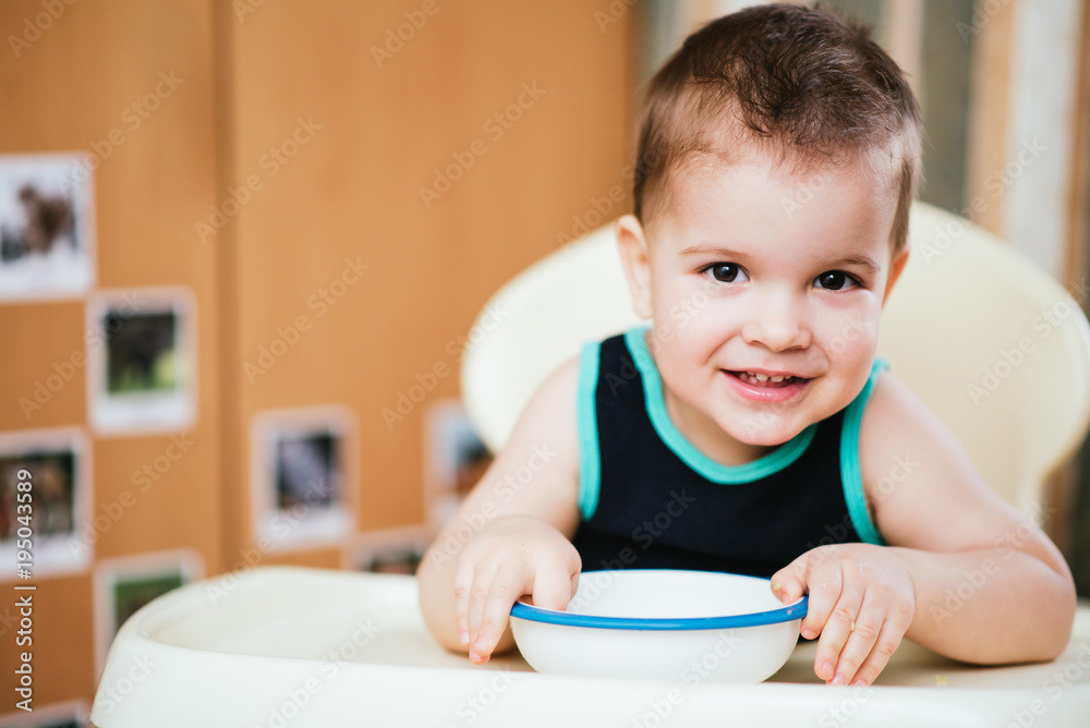 the child in the kitchen eats milk porridge the child in the kitchen eats milk porridge