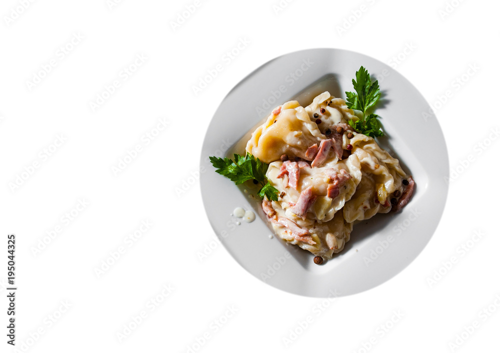 Meat dumplings - russian pelmeni, ravioli with meat on plate isolated on white background. with copy space. top view