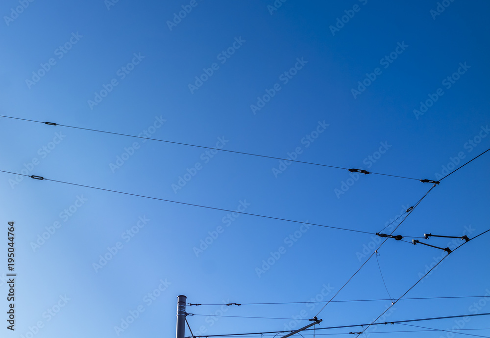 Railroad overhead lines against clear blue sky Contact wire Railroad overhead lines against clear blue sky Contact wire