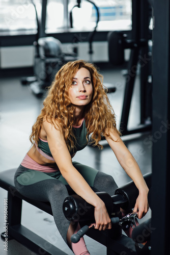 Young athletic woman in the gym