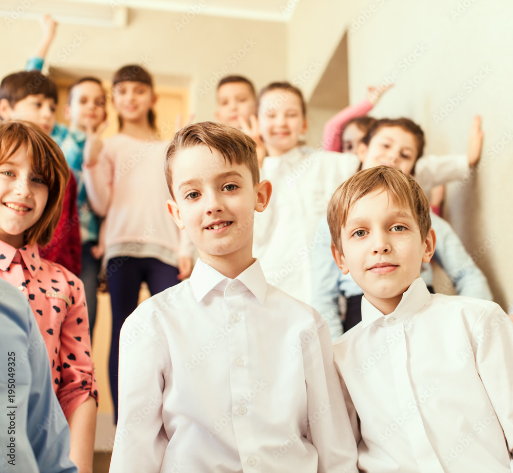 Fototapeta premium Pupils standing on the stairs