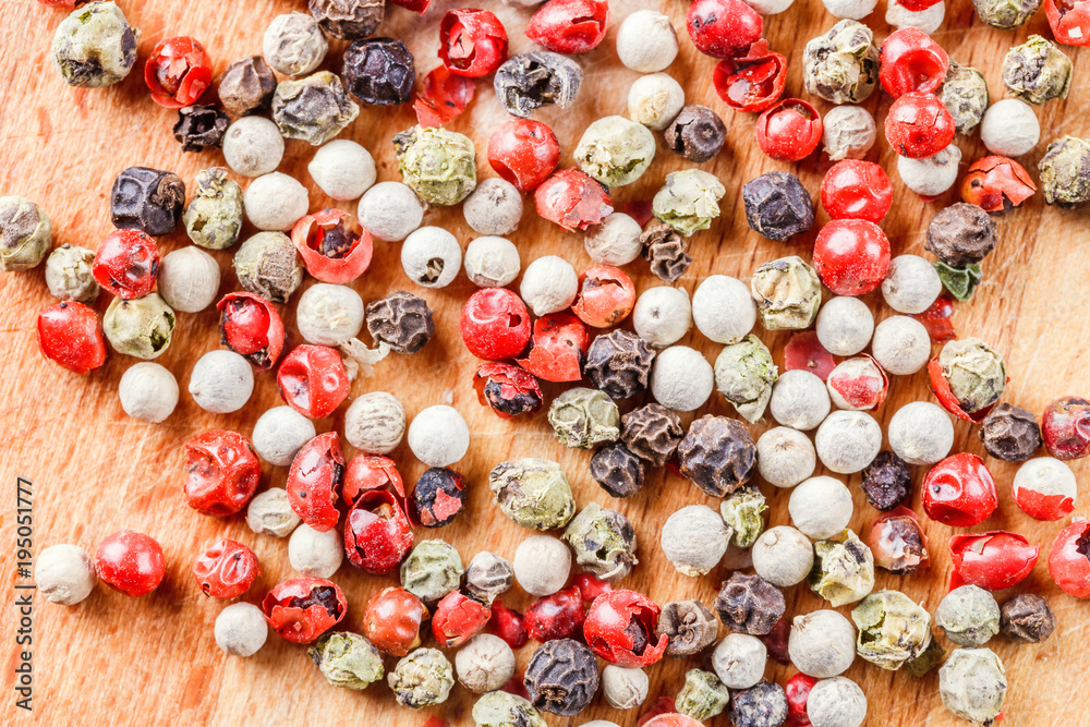 The pepper mix on a wooden background The pepper mix on a wooden background