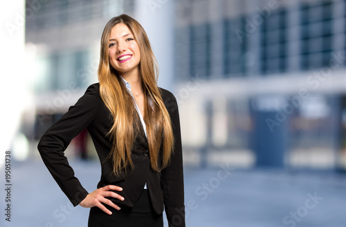 Young female manager smiling Free Download Young female manager smiling - GFXLoad