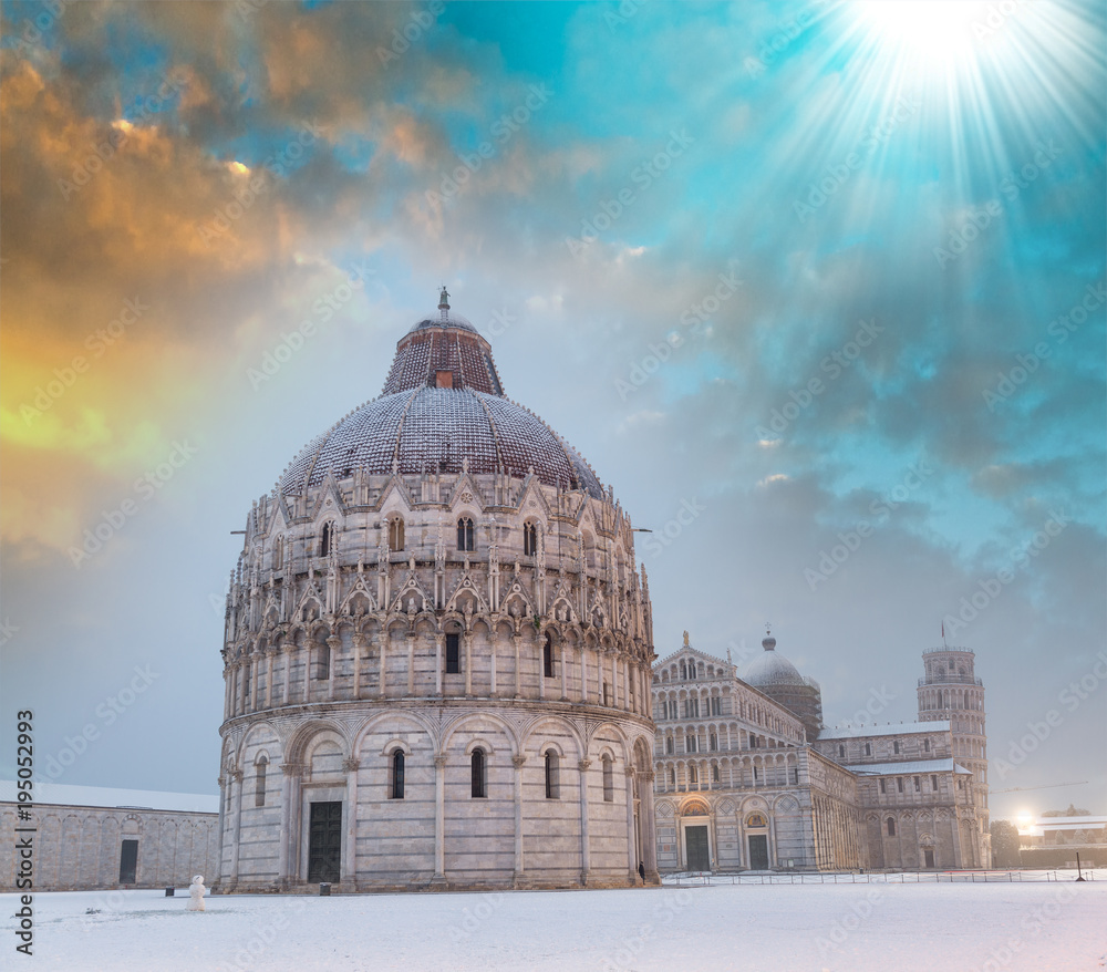 Baptistery of Pisa after a winter snowfall at dusk. Square of Miracles at dawn