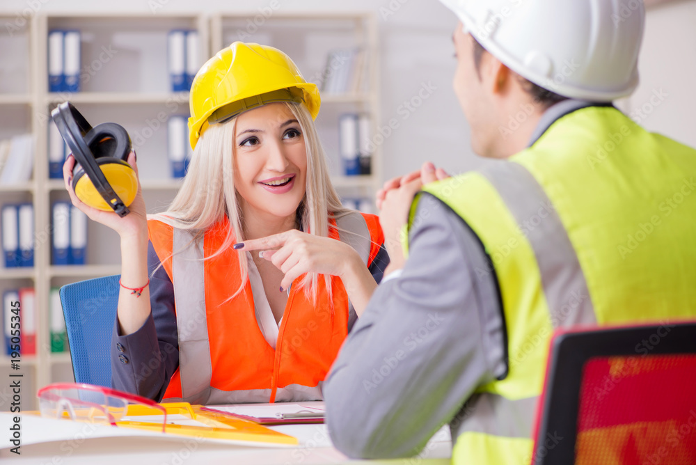 Construction workers having discussion in office before starting Construction workers having discussion in office before starting