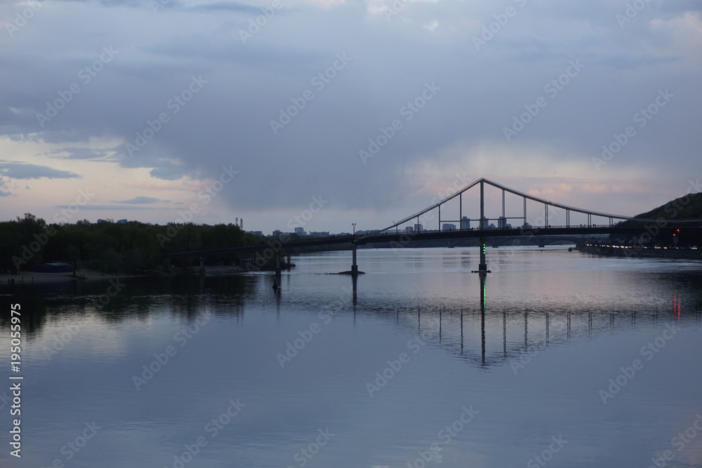 Bridge construction with reflection in river Dnieper, Kiev, Ukraine. Dnipro, Kyiv. 