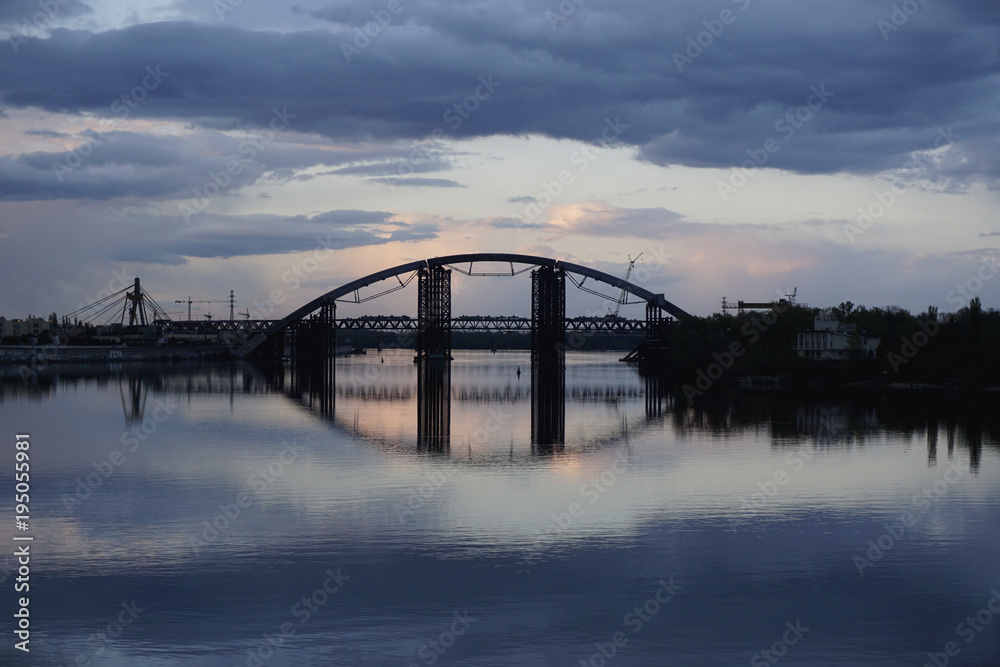 Bridge construction with reflection in river Dnieper, Kiev, Ukraine. Dnipro, Kyiv. 