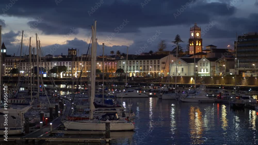 Yahts and evening lights of Ponta Delgada. Panning shot. Sao Miguel Island, Portuguese archipelago of the Azores. Yahts and evening lights of Ponta Delgada. Panning shot. Sao Miguel Island, Portuguese archipelago of the Azores.
