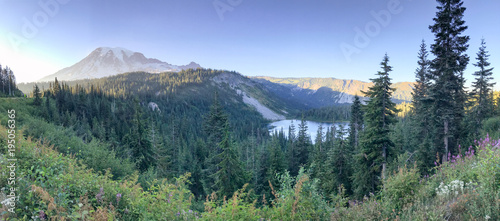 Panoramic view of Mt Rainier lake and forest on a beautiful summer day