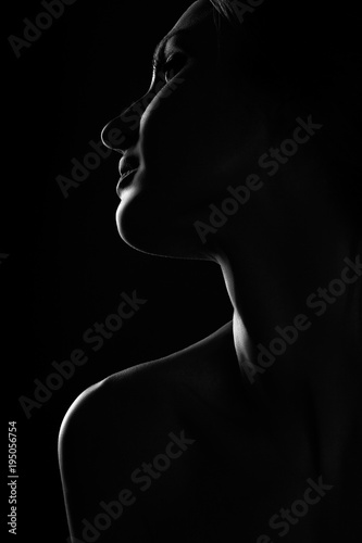 black and white profile portrait of female in back ligt art photography