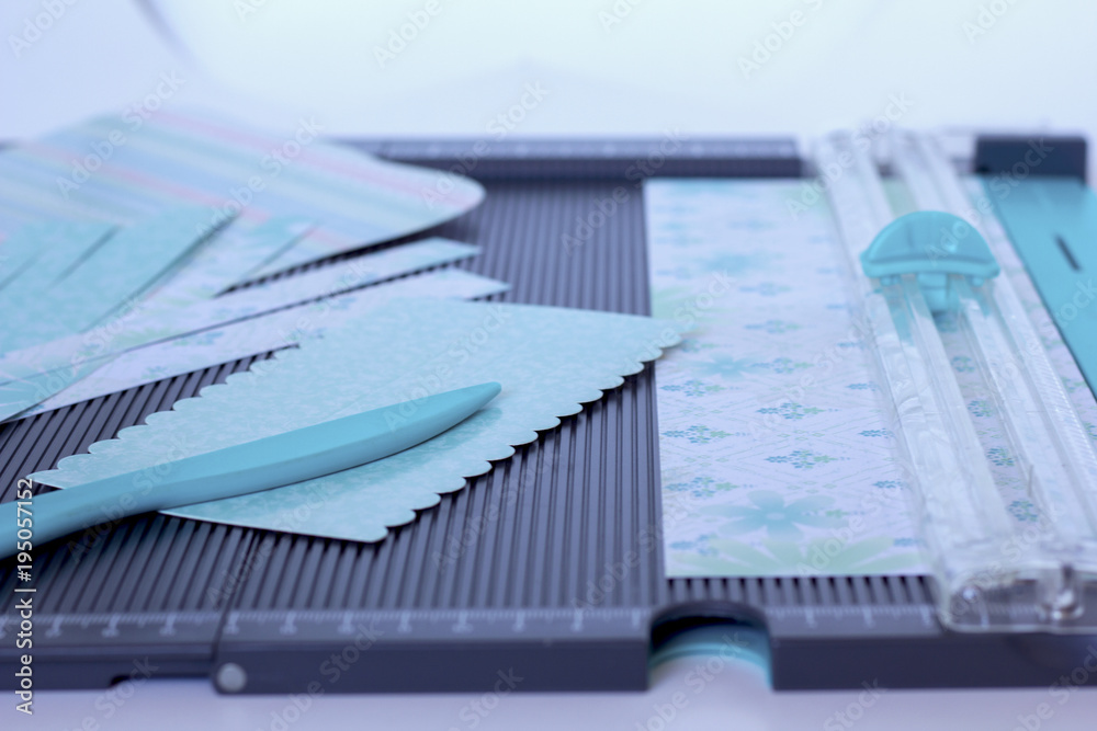     paper creasing and cutting board in the world of needlework and scrapbooking