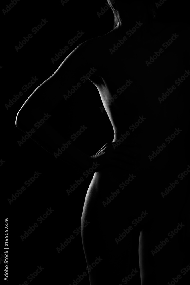 black and white female body in back light art photography