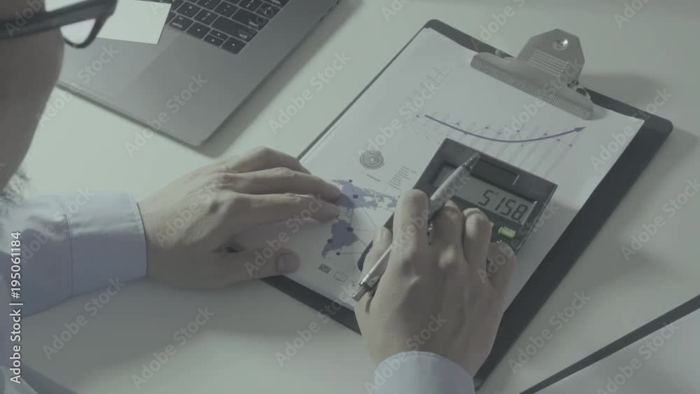 businessman hand working with finances about cost and calculator and laptop with mobile phone on withe desk in modern office
businessman hand working with finances about cost and calculator and laptop with mobile phone on withe desk in modern office
