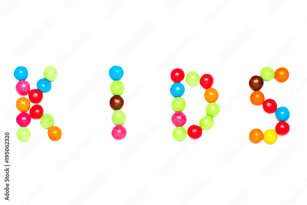 text KIDS is written by sweet colorful chocolate candy isolated on white background text KIDS is written by sweet colorful chocolate candy isolated on white background