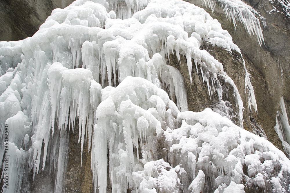 Frozen waterfall with icicles seen in the park