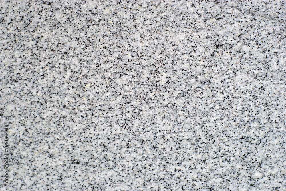 background, texture - surface of a polished slab of gray variegated granite background, texture - surface of a polished slab of gray variegated granite