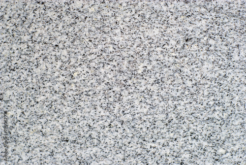 background, texture - surface of a polished slab of gray variegated granite