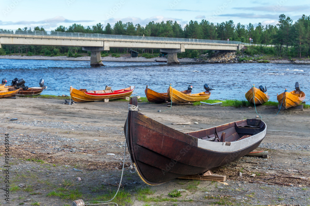 Wooden boats on the bank of river, Finnmark, Norway