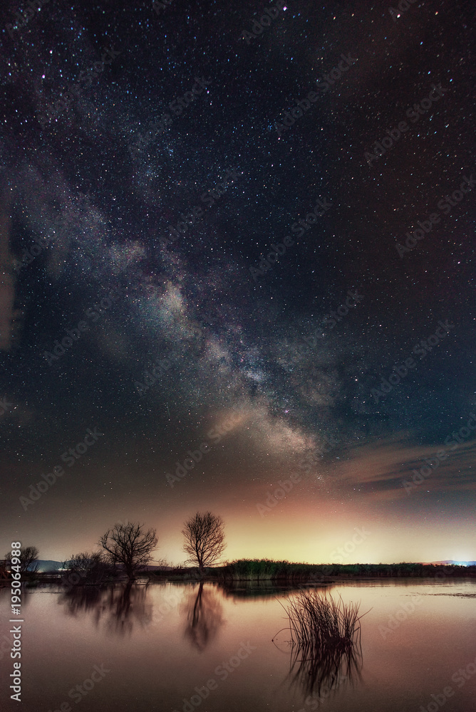 Milky Way over the lake. Milky Way galaxy over the Dojran Lake, FYR Macedonia. The night sky is astronomically accurate.