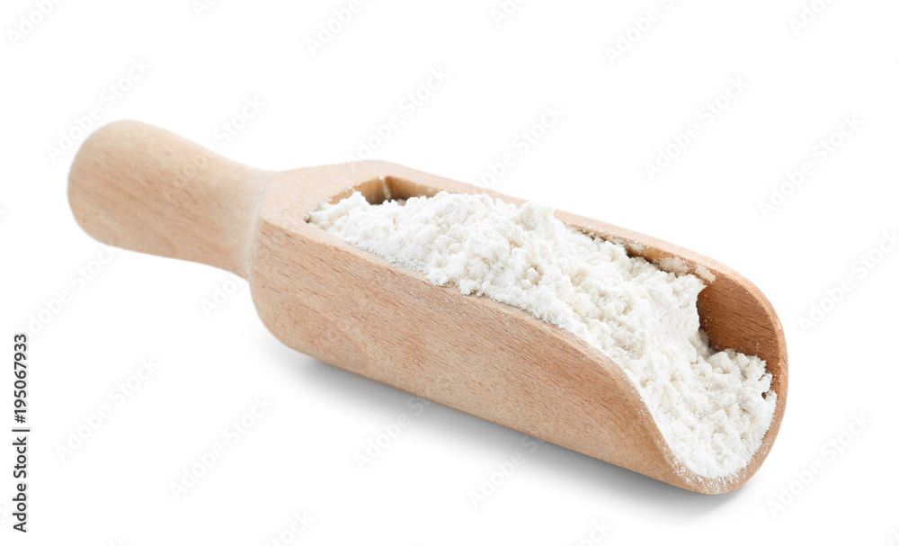 Wheat flour in wooden scoop on white background Wheat flour in wooden scoop on white background