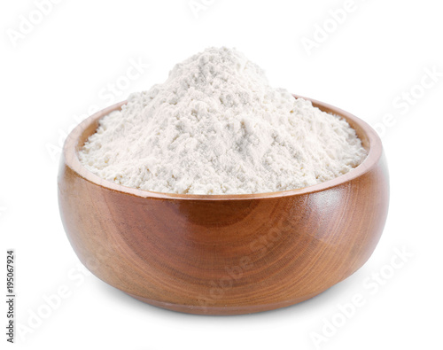 Wheat flour in wooden bowl on white background