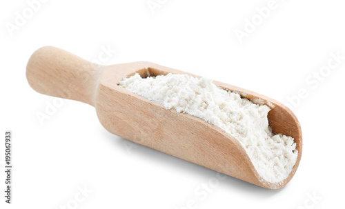 Wheat flour in wooden scoop on white background