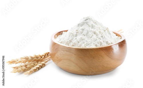 Wheat flour in bowl on white background