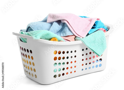 Tableau sur toile Laundry basket with dirty towels on white background
