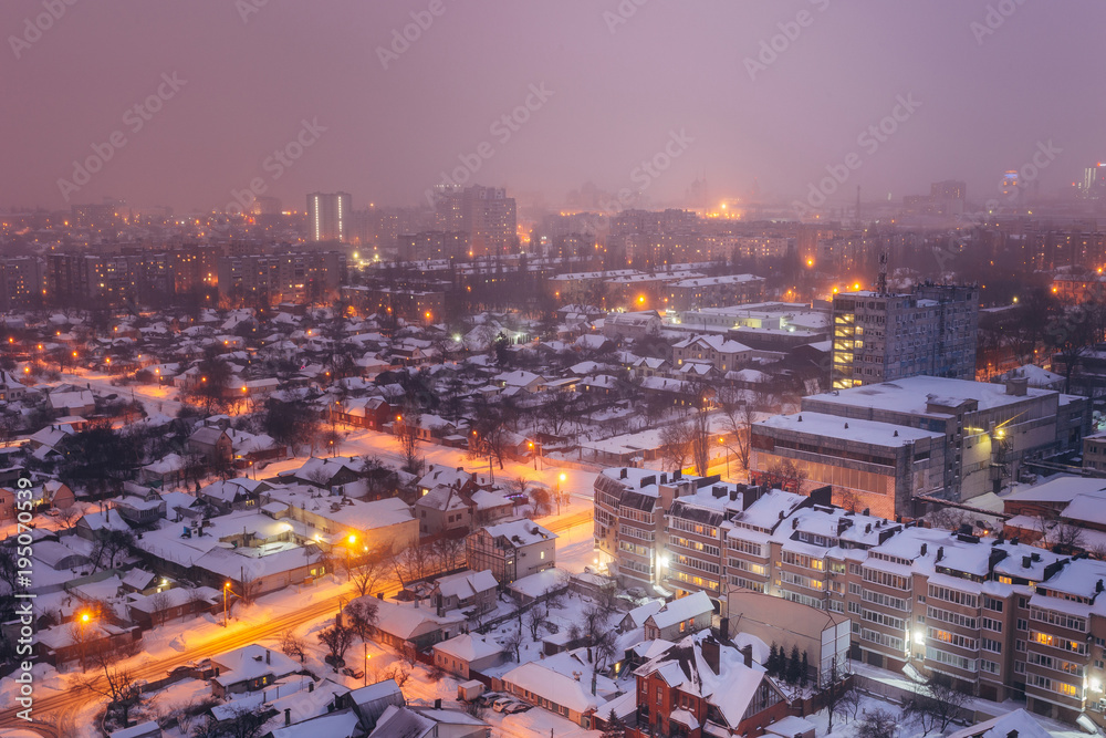 Fog, snowstorm at winter night in Voronezh. Aerial view