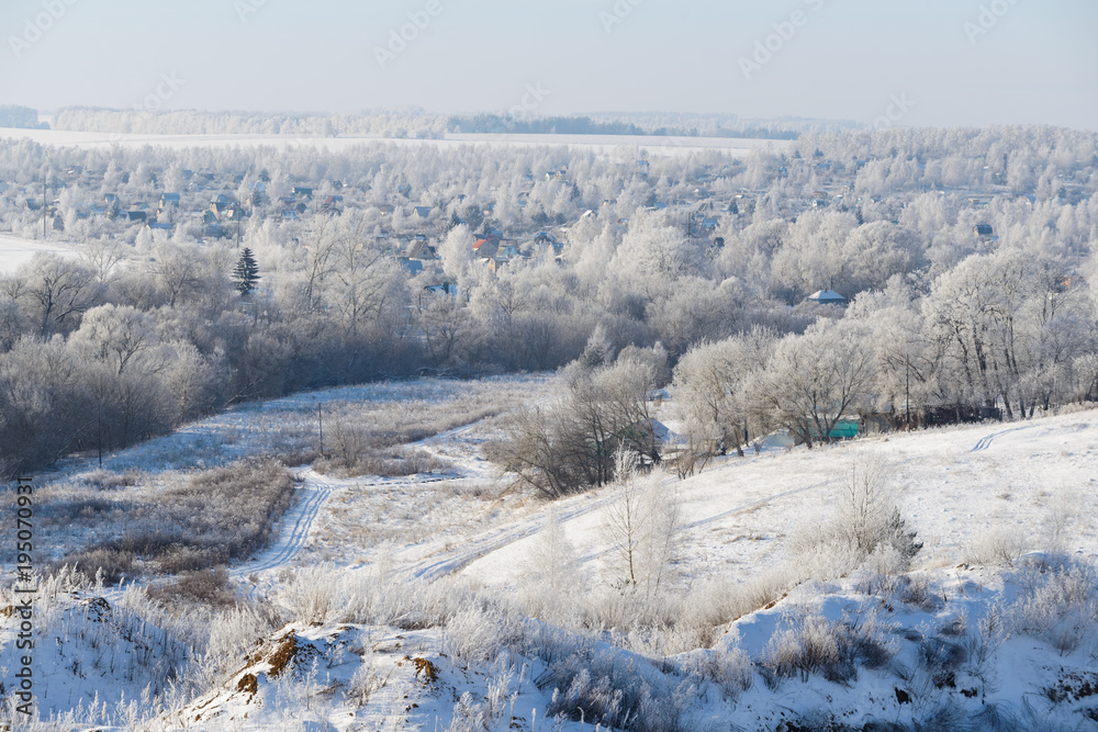 Rural winter landscape with white frost in the ravine Rural winter landscape with white frost in the ravine