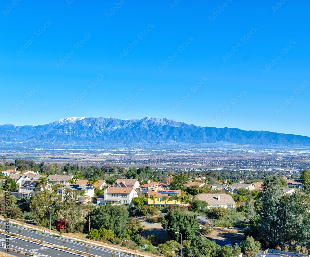 Snow on distant mountains in Southern California suburbs
