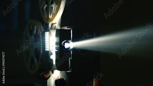 Cinema Film Projector with sound dip to white.