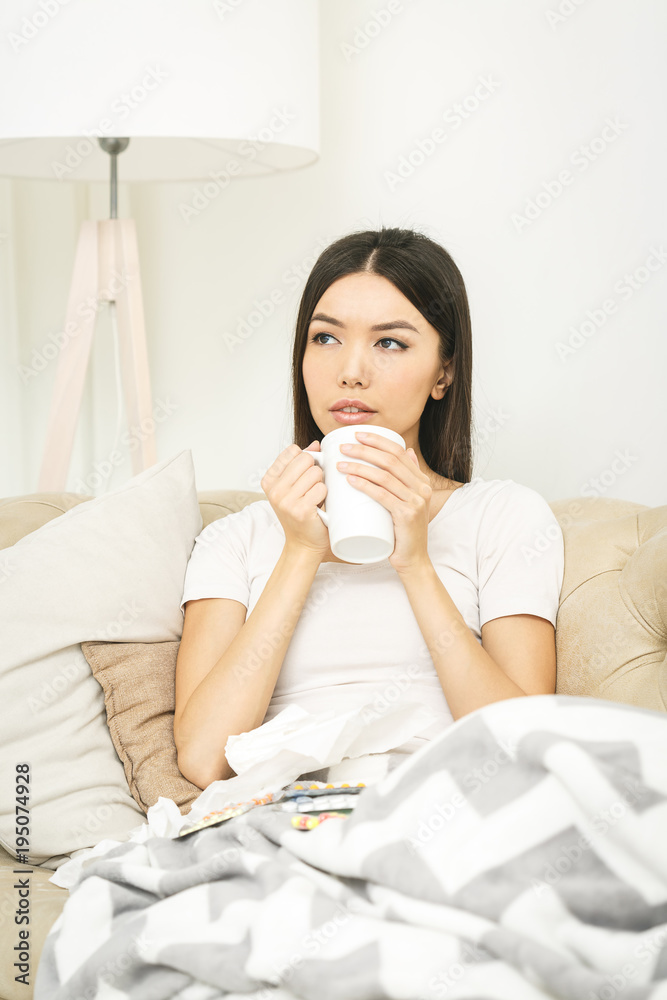 Sick woman lying in bed with high fever. Cold, flu, fever and migraine Sick woman lying in bed with high fever. Cold, flu, fever and migraine
