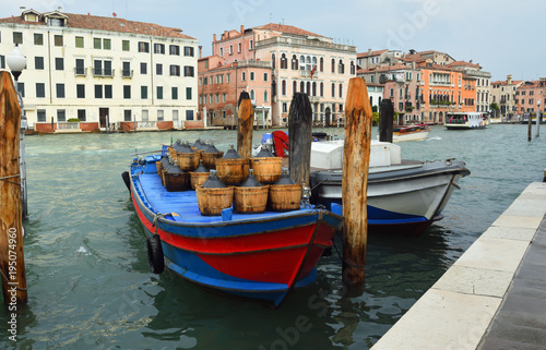VENICE, ITALY - SEPTEMBER 24. 2017: Cargo Boats on the busy Grand Canal , Venice Italy.