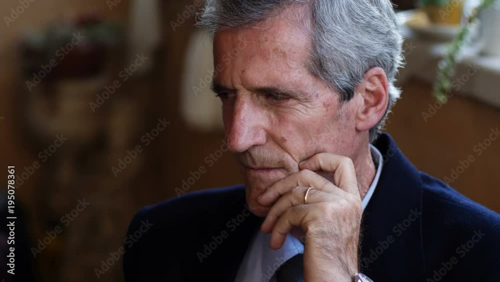 Serious handsome mature business man staring at camera Serious handsome mature business man staring at camera