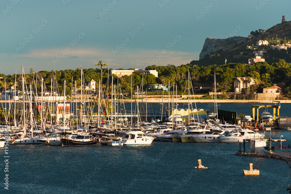 Port of Denia with a parked boat view of the mountain.
